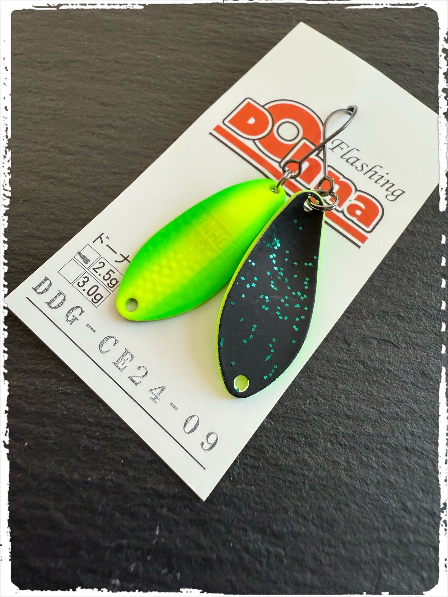Angler'z System Antem Dohna DDG-CE24 #09 spoon with vibrant color and sleek design, ideal for fishing enthusiasts.