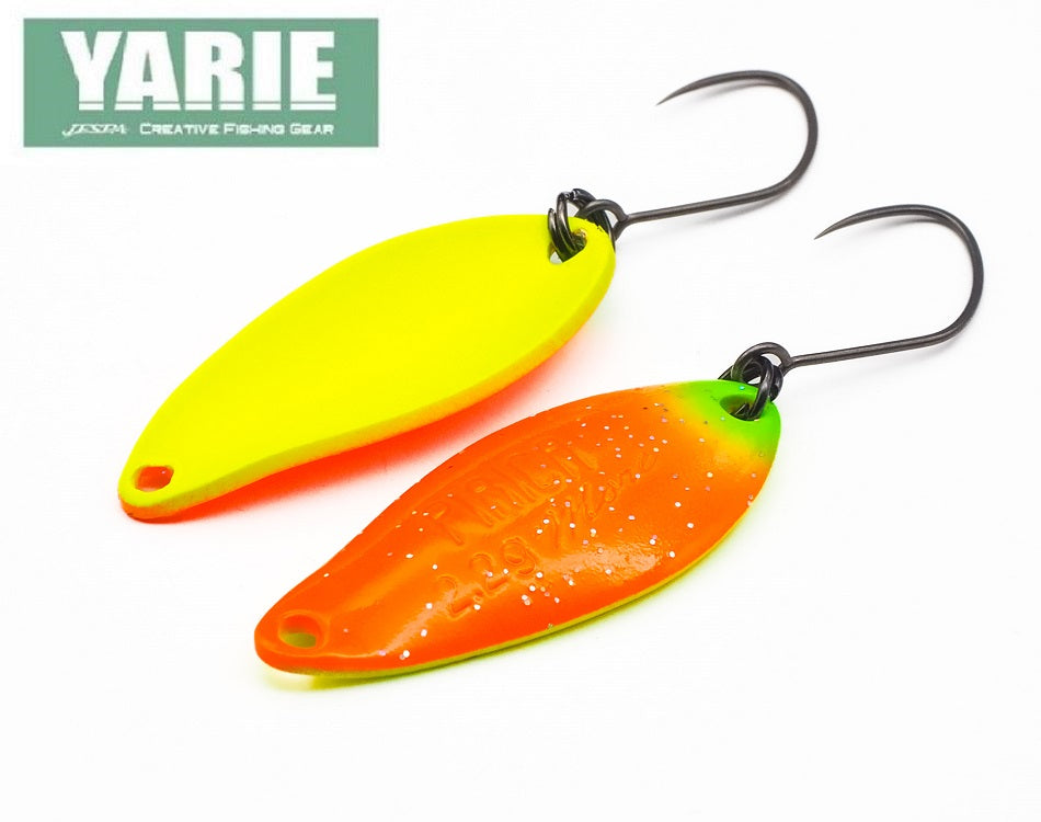 Yarie Spoon PIRICA E71 GLOW in vibrant colors, showcasing its unique design and curved shape for effective fishing.