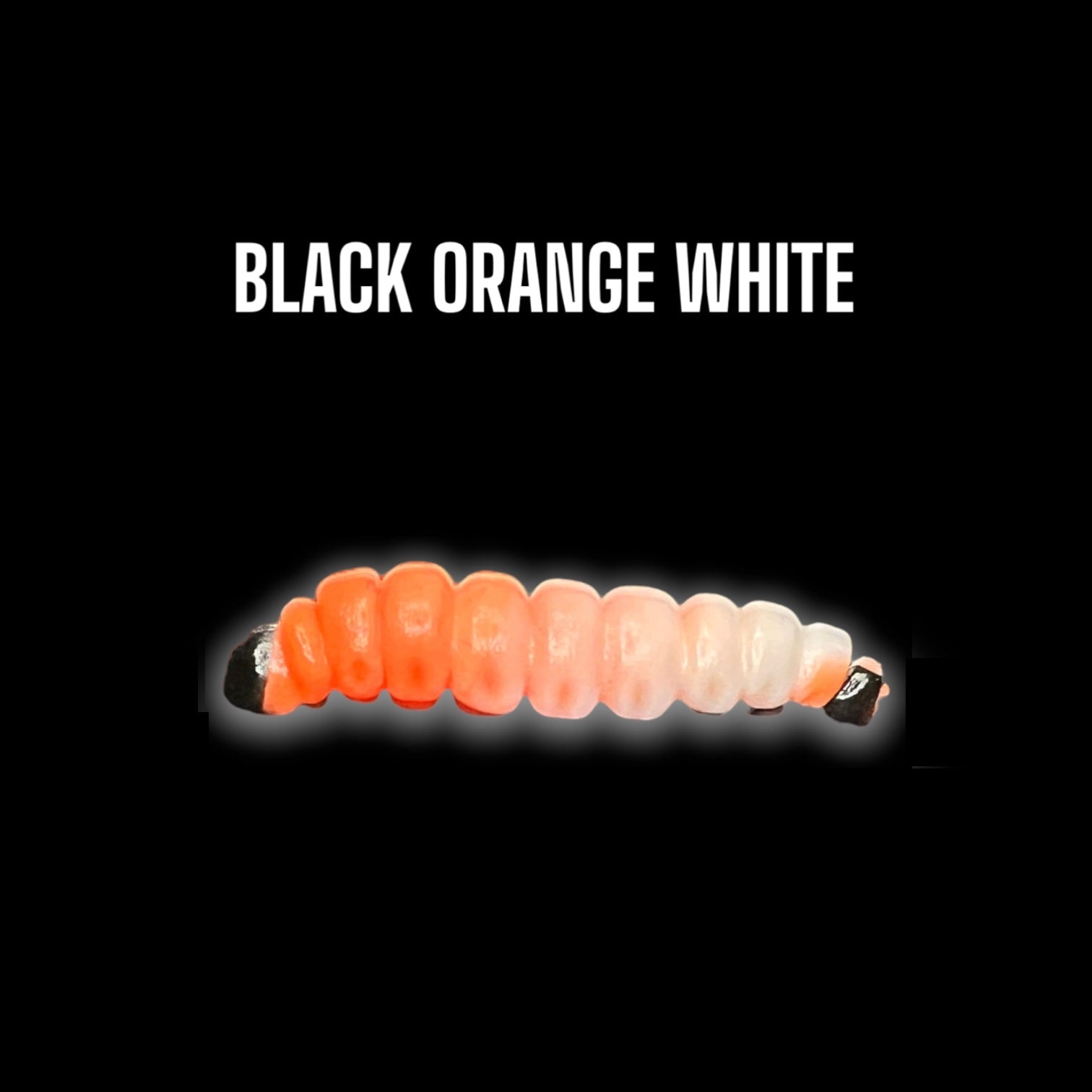 SE-BAITS MG Maggy Extreme Floating gummiköder in black, orange, and white colors displayed on a neutral background.