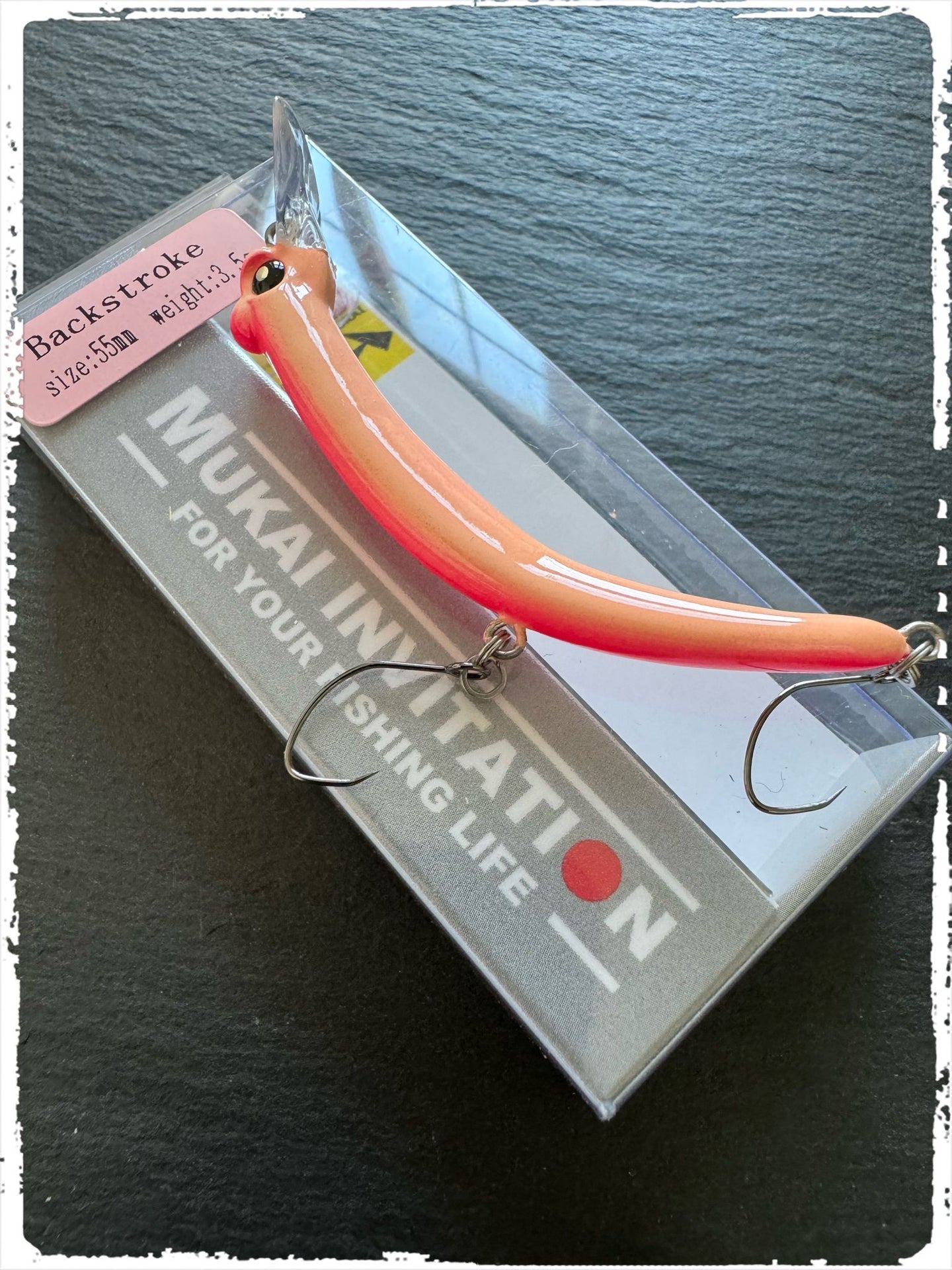 Mukai Backstroke 55 S wobbler in vibrant colors, showcasing its realistic design and detailed finish for effective fishing.