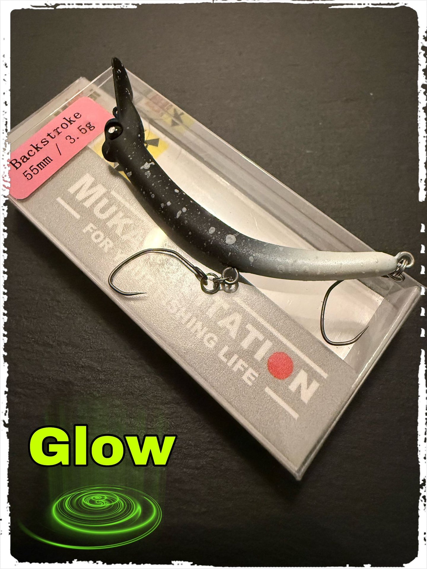 Mukai Backstroke 55 S wobbler in vibrant colors, showcasing its realistic design and streamlined shape for fishing.