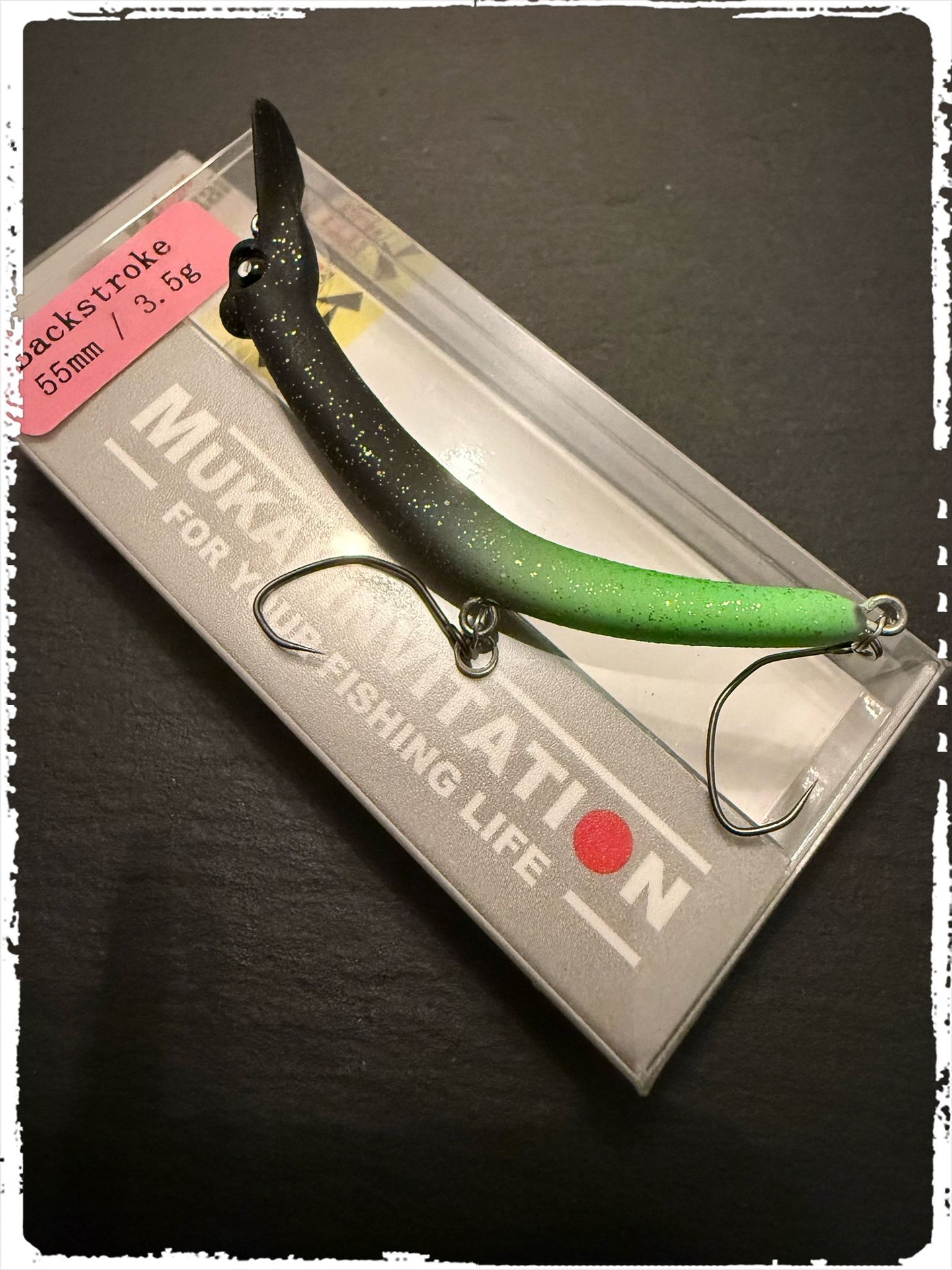 Mukai Backstroke 55 S wobbler in vibrant colors, showcasing its realistic design for attracting fish.