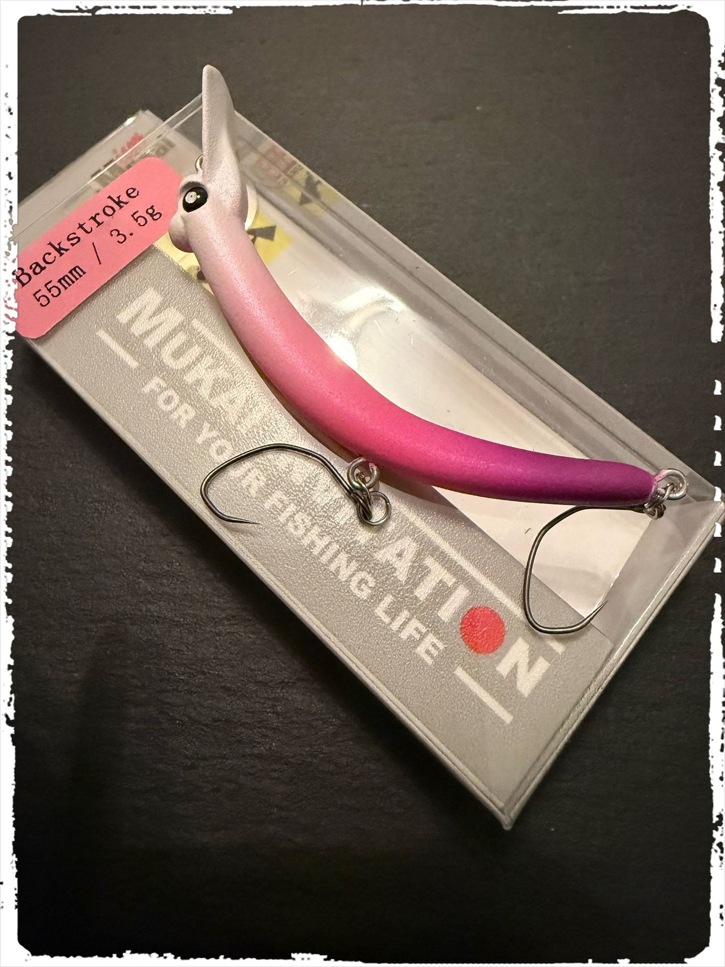 Mukai Backstroke 55 S wobbler lure with realistic detailing and vibrant colors for fishing enthusiasts.